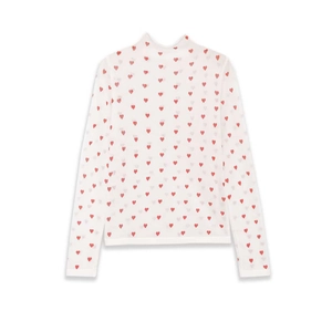 White high neck long sleeve top with red heart patterns on a clean white background