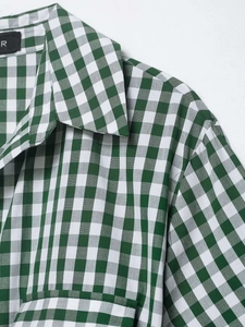 Detail view of the green and white gingham shirt collar with professional stitching