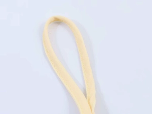 Detail of light yellow lace camisole strap with reinforced double stitching work