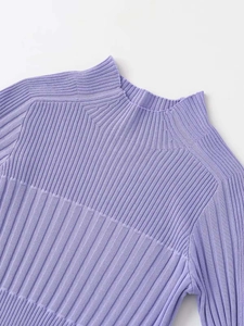 Detail of light purple ribbed knit sweater showing high neckline and texture