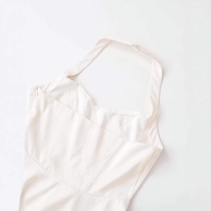 Elegant cream white halter neck dress with structural seams and side zipper closure