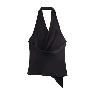Detail of black satin halter top featuring a cowl neck and irregular asymmetric hemline