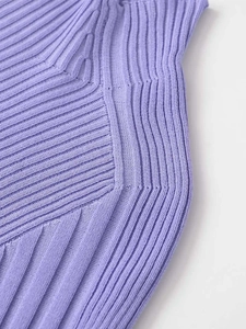 Close-up of lilac ribbed knit texture showing geometric stitching and soft fabric detail