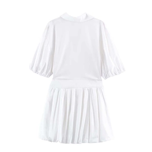 White puff sleeve shirt dress with V-neckline and pleated hem on a clean white background