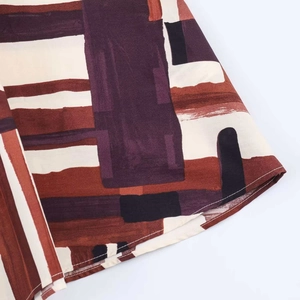 Retro geometric print skirt in reddish brown and purple with high-quality stitching details