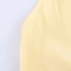 Detail shot of yellow satin fabric showing fine texture and neat stitching quality