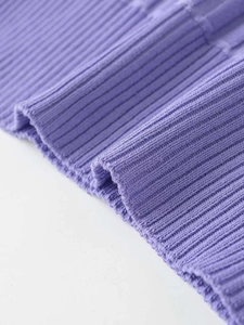 Close-up of lilac rib-knit fabric texture showing soft vertical knitted stripes and elasticity