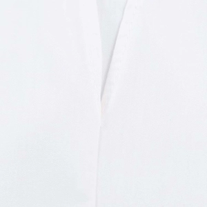Close-up of white cotton fabric showing high-density weaving and reinforced stitching detail