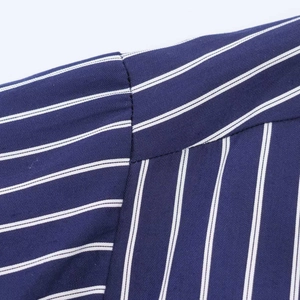 Blue striped shirt with puff sleeves showing shoulder seam detail and fabric texture