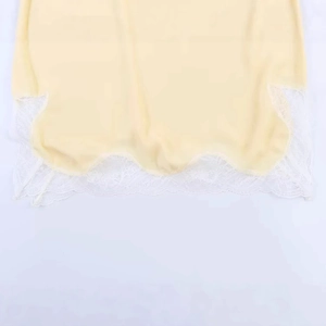 Lace-trimmed yellow spaghetti strap top with delicate white floral embroidery and scallops