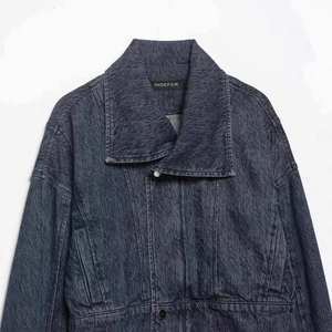 Vintage dark gray washed denim jacket with distressed texture and relaxed drop shoulders
