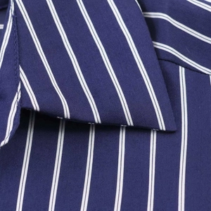 Detailed view of the dark blue striped shirt neckline showing fine stitching and fabric texture
