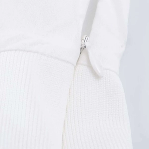 Close-up of invisible white zipper and ribbed fabric texture on cotton summer dress