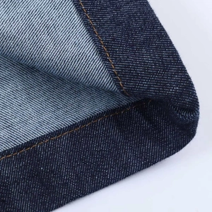 Deep blue denim mini dress featuring contrast yellow stitching and puff sleeve detail