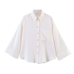 Minimalist white loose-fit long sleeve shirt for women featuring lapel and chest pocket