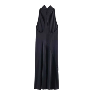 Detailed view of black satin halter dress featuring an open back and silky texture fabric