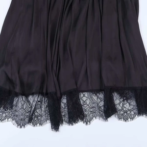 Elegant black satin halter dress featuring a delicate eyelash lace hem and silky texture