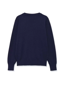 Rear view of navy blue long sleeve knit sweater showing rib knit cuffs and hem detail