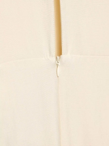Detailed close-up showing the seamless invisible zipper on the apricot summer dress