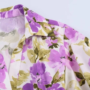 Detailed view of the summer floral dress neckline with purple and green flower prints