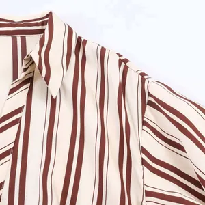 Detail of tan and off-white striped woven fabric showing the notch lapel and stitching