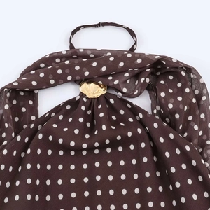 Polka dot halter top in brown with white patterns and gold buckle detail
