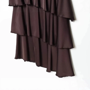 Elegant chocolate satin maxi dress featuring tiered ruffle layers and a glossy finish