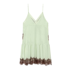 Summer mini dress featuring light green fabric with contrast coffee lace trim and thin straps