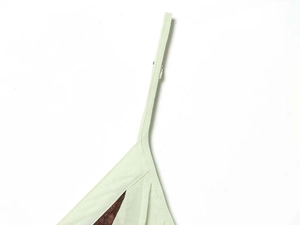 Detailed close-up of light green dress with brown lace stitching and fine strap seams