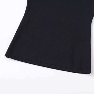 Close-up of black knit sweater hem featuring detailed stitching and premium ribbed texture