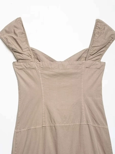 Close-up of khaki midi dress featuring a sweetheart V-neckline and pleated wide shoulder straps