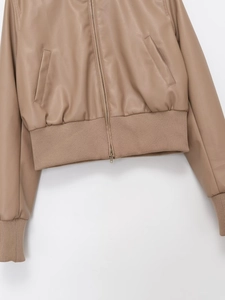 Detail of khaki faux leather bomber jacket with ribbed hem and smooth zipper closure