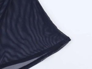 Close-up of the breathable dark mesh fabric showing the detailed honeycomb knit structure