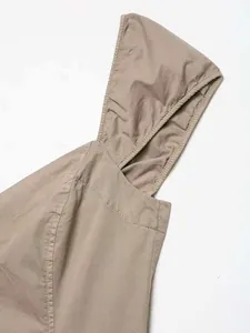 Detail of khaki midi dress with button accents and durable twill fabric hood texture