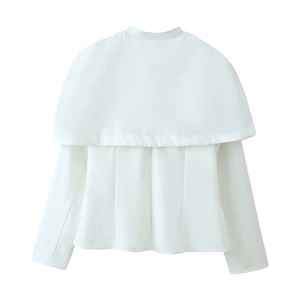 Detail of white cropped blazer jacket featuring tiered shawl cape and long sleeves
