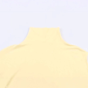 Pale yellow turtleneck knit top featuring an asymmetric floating sleeve design