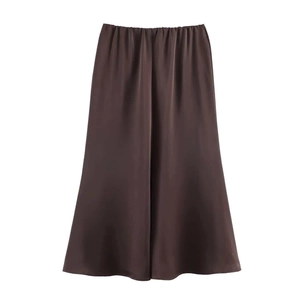 Detailed view of dark brown acetate satin midi skirt with silk texture and elastic waist