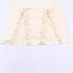Chic light beige midi dress with elegant vertical ruffles and minimalist layered design