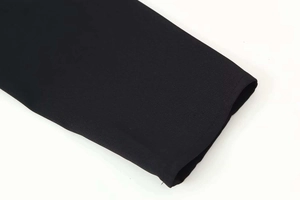 Detailed close-up showing the cuff stitching and premium fabric texture of this black jacket