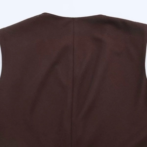 Detailed close-up of back neckline and stitching on dark brown sleeveless vest