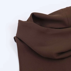 Detailed view of chocolate brown cowl neck and stitching on minimalist sleeveless top