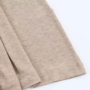Detail view of khaki knit dress hemline showing fine stitching and plain weave texture