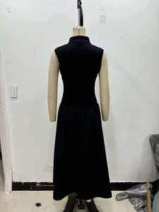 Slim fit sleeveless black knit midi dress with a high collar back view on model