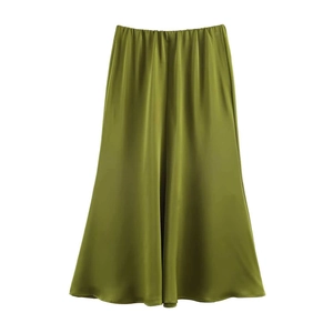 Detail of the olive green satin skirt with elastic waist and smooth silk texture