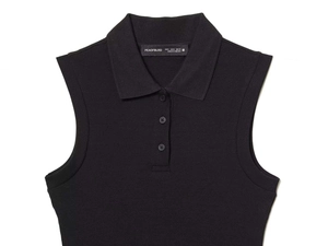 Close-up of black sleeveless knit polo top with classic collar and ribbed texture details