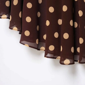 Polka dot asymmetric midi skirt in dark brown chiffon with elegant pleated drape