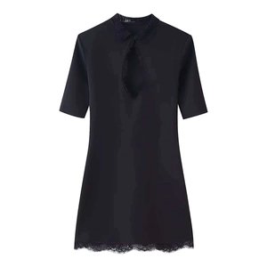 Black short sleeve dress with lace trim, collar design and cutout front on white background