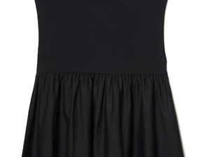 Detail of waist stitching with knitted ribbing and pleated woven fabric in black dress
