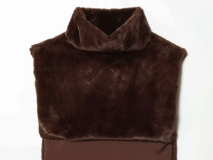 Detail of faux fur high collar with brown knitted fabric for winter warmth