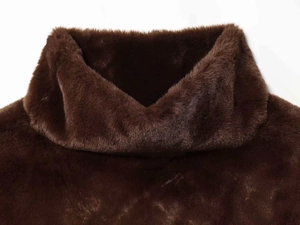 Close-up of the thick brown faux fur texture and high collar detail of this winter vest